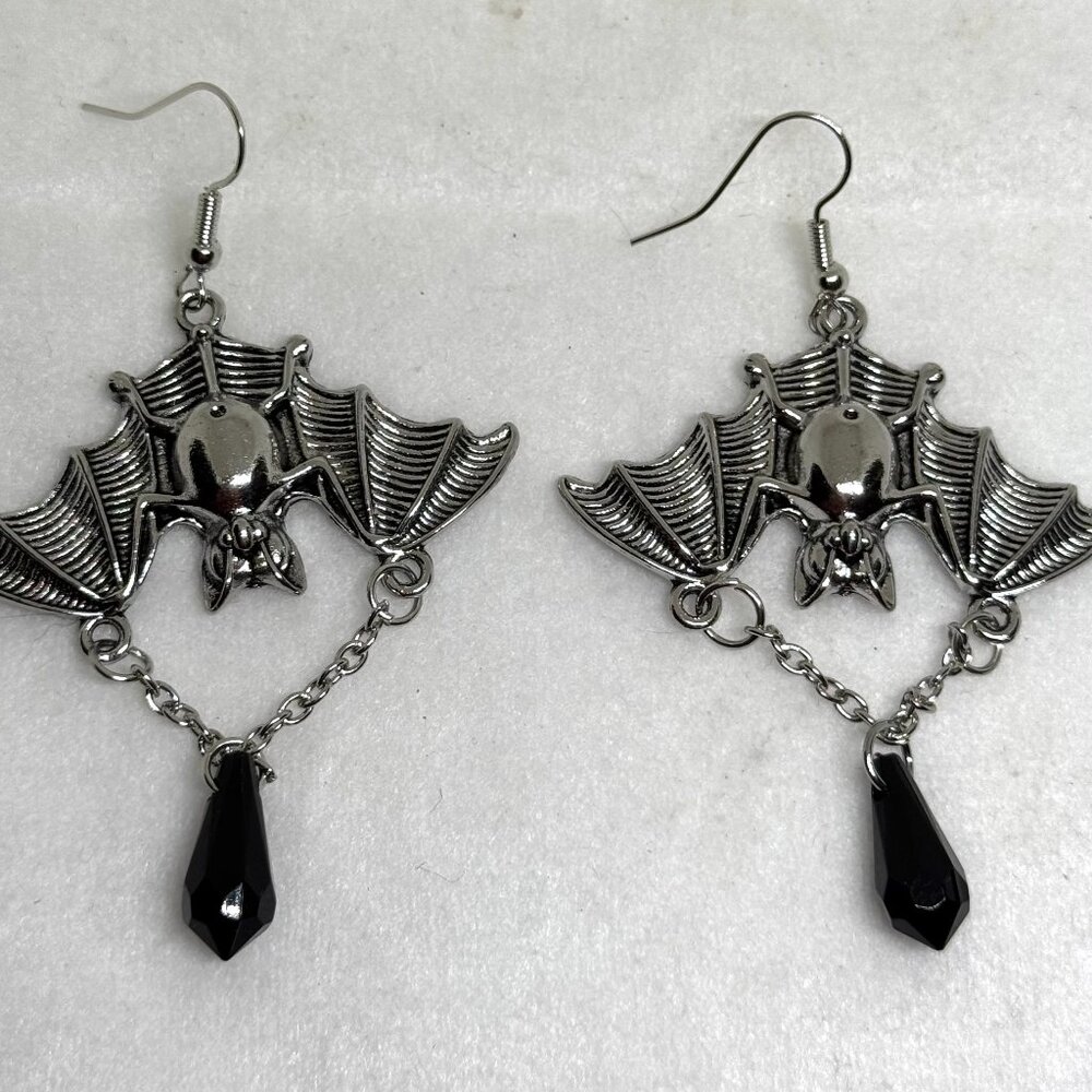 Silvertone bat earrings with dangling black crystal teardrop, NWOT